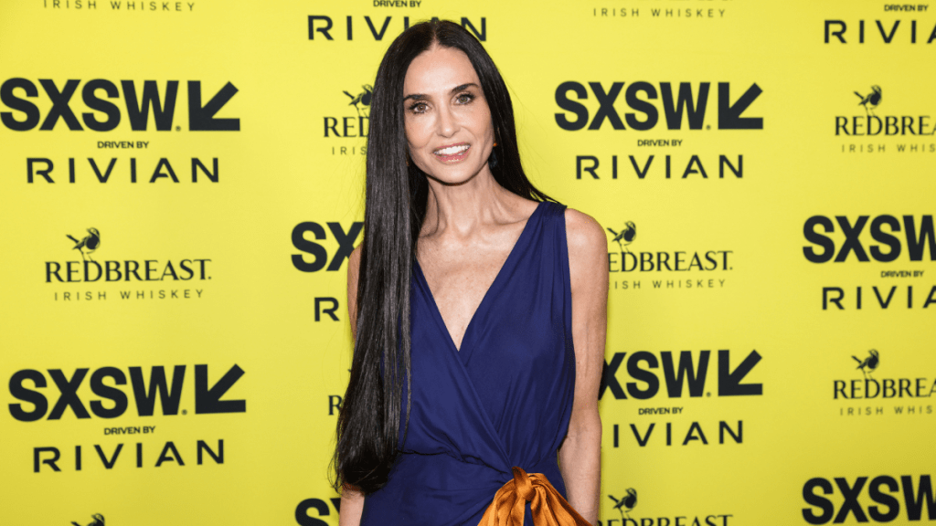 Demi Moore's Saint Laurent Dress Features Ridiculously High Slit & Bows