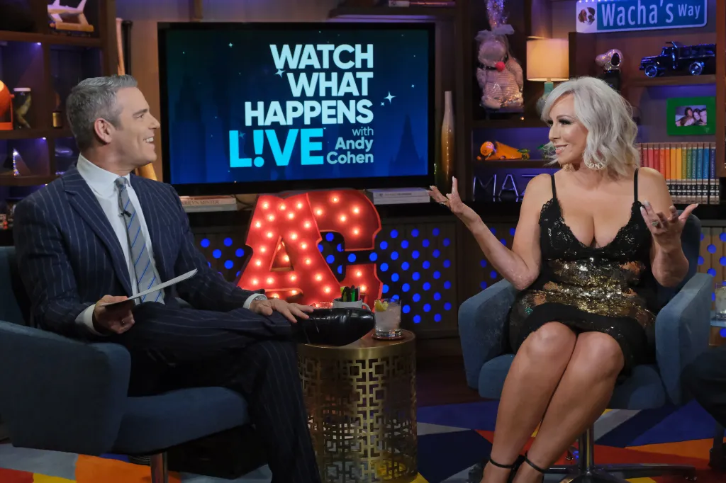 Andy Cohen and Margaret Josephs sitting across from each other on Watch What Happens Live