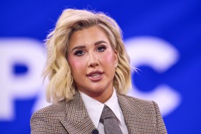 Savannah Chrisley wearing a blazer and sitting with her mouth open at CPAC