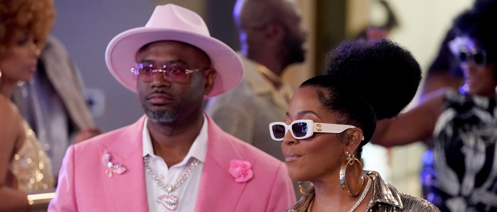 Dr. Eugene Harris in a pink suit and Toya Bush Harris in sunglasses on Married to Medicine Season 12