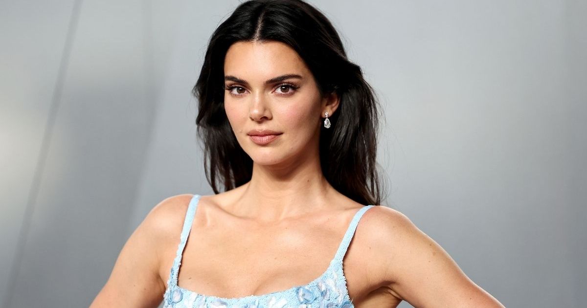 Kendall Jenner Keeps It Bold & Fun in Striped Bikini Look for Vacation