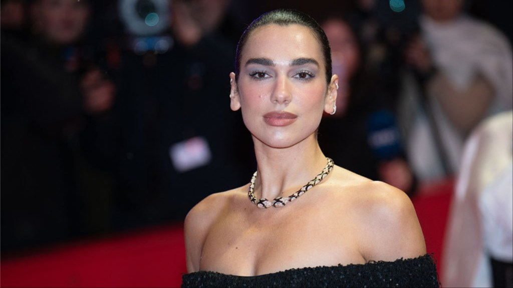 Dua Lipa’s Oseree Bikini Top Literally Hangs by Strings in Beach Photo