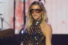 Kesha Poses in Sheer Corset Top With Big Cut-Out to Celebrate Women’s Day