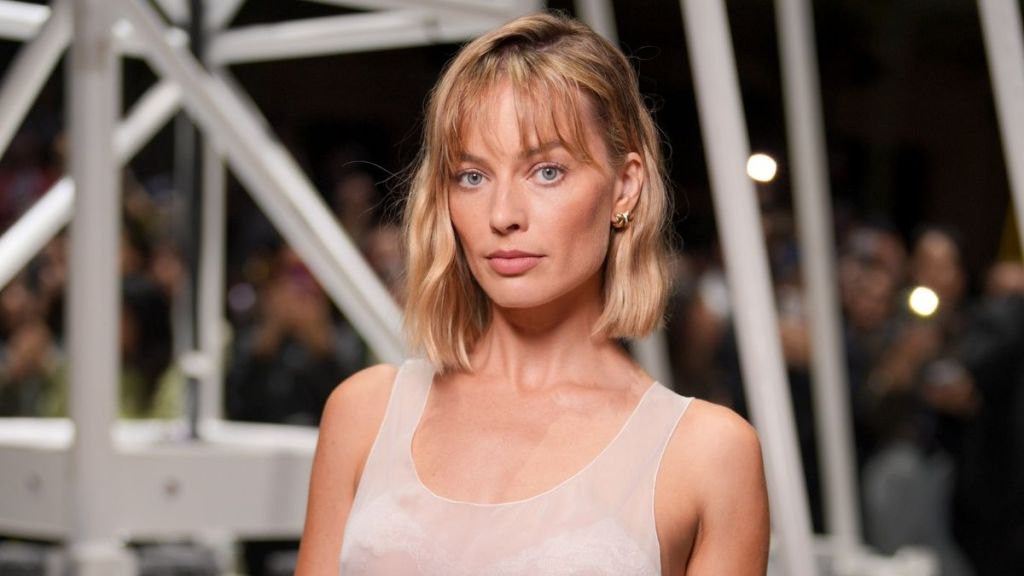 Margot Robbie Swaps Chanel Handbags in Chic Open-Jacket Look for Campaign