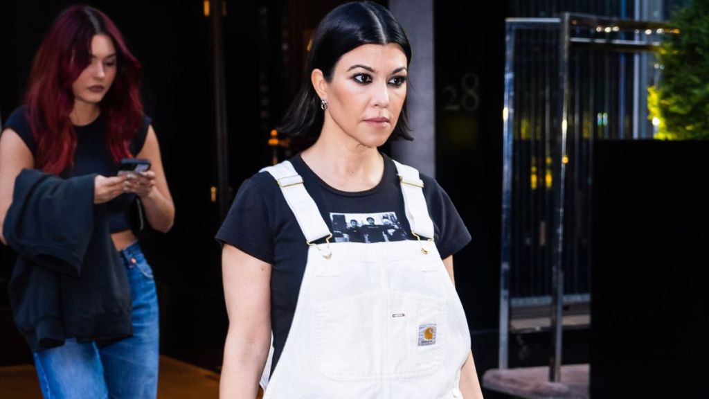 Kourtney Kardashian Poses in a Slip Dress & Sheer Socks in Bed for Lemme