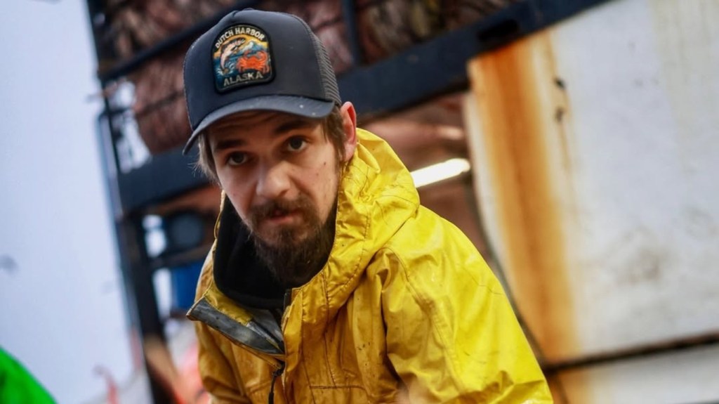 Todd Meadows from Deadliest Catch handling crabs on board a boat