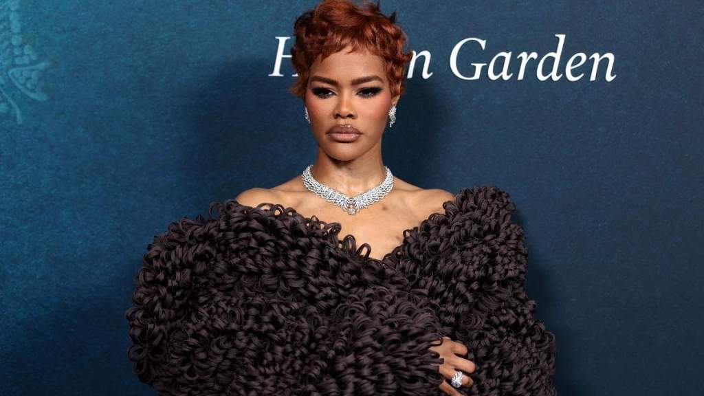 Teyana Taylor’s Textured Calvin Klein Coat Pulls Double Duty as Bold Dress