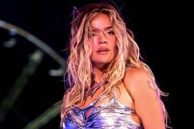 Karol G Debuts Bold Tank Top & Micro Shorts Look in New Tour Announcement Video