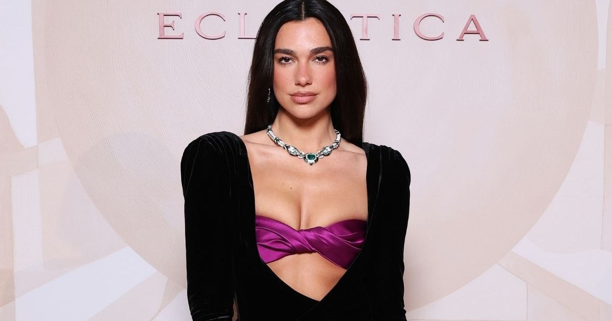 Dua Lipa Nails Peekaboo Trend in Gucci Jacket Literally Held With Button
