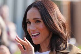Meghan Markle's Posse Skirt Suit Comes With a Super Daring High Slit