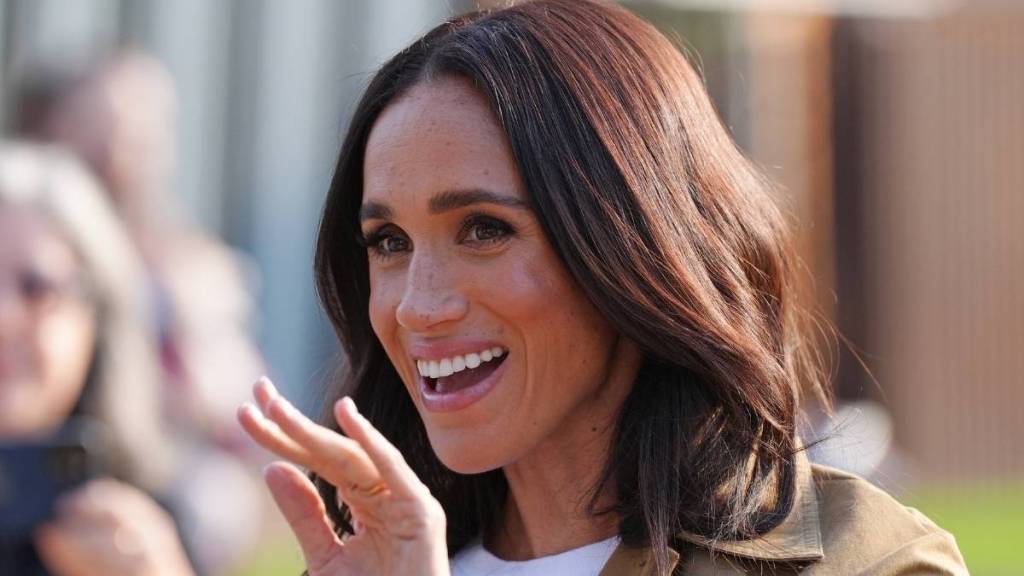 Meghan Markle's Posse Skirt Suit Comes With a Super Daring High Slit