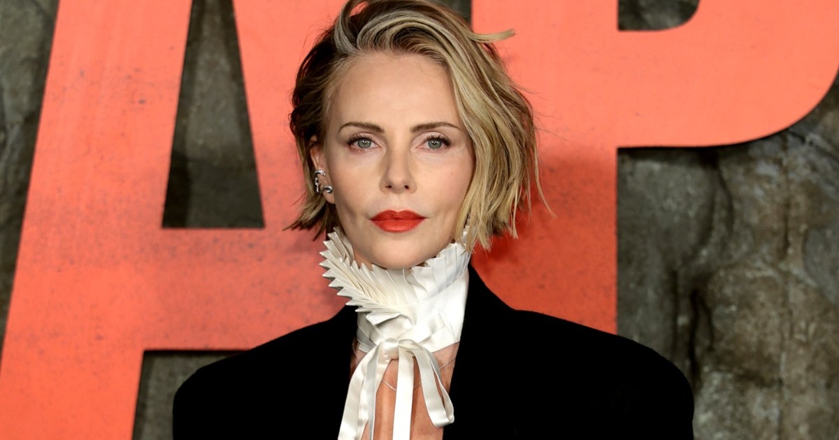 Charlize Theron Goes Topless Under Sleek Blazer for Apex Premiere
