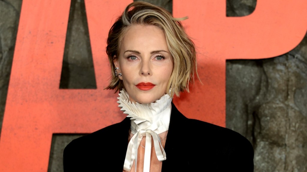 Charlize Theron Goes Topless Under Sleek Blazer for Apex Premiere