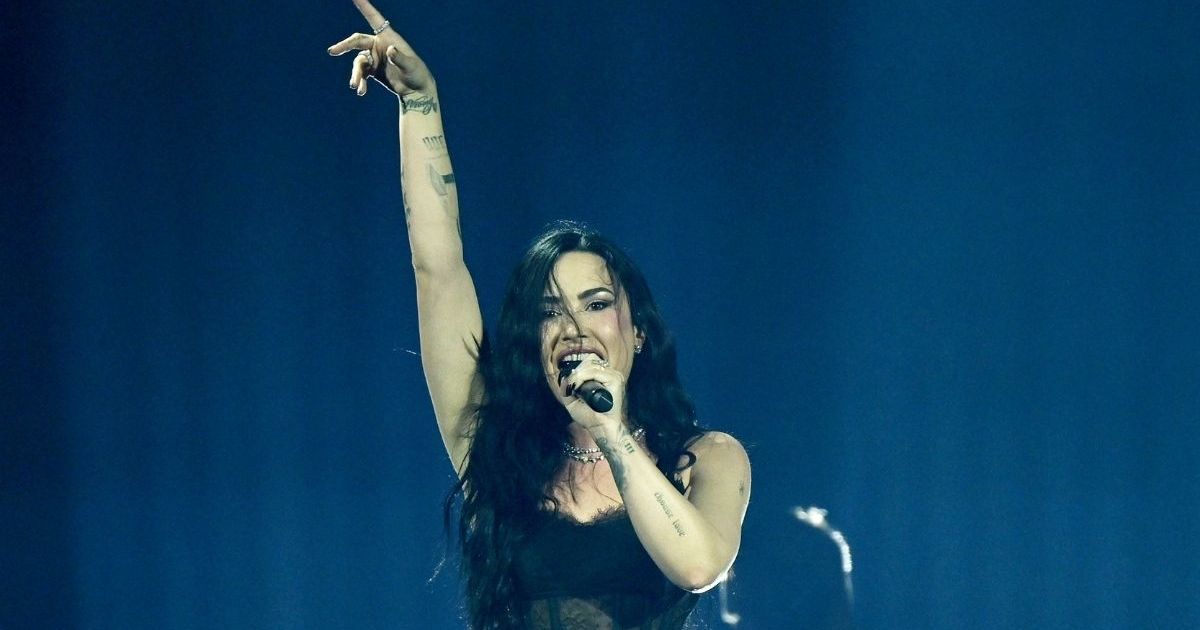 Demi Lovato Goes Boldly Sheer in Bodysuit & Fishnet Tights for Tour