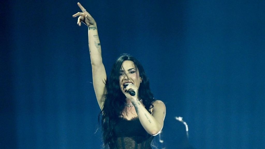 Demi Lovato Goes Boldly Sheer in Bodysuit & Fishnet Tights for Tour