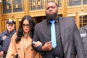 Jen Shah in a brown coat leaving court, locked arms with a man in a black suit