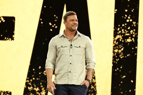 Alan Ritchson in a button up shirt on stage at the Amazon Upfronts
