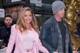 Denise Richards in a pink suit, walking down the street holding hands with Aaron Phypers