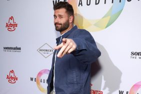 Dakota Mortensen in a blue jacket, pointing at the camera