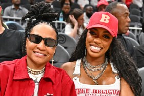 Patrice "Sway" McKinney and Porsha Williams attend the game between the Dallas Mavericks and the Atlanta Hawks at State Farm Arena