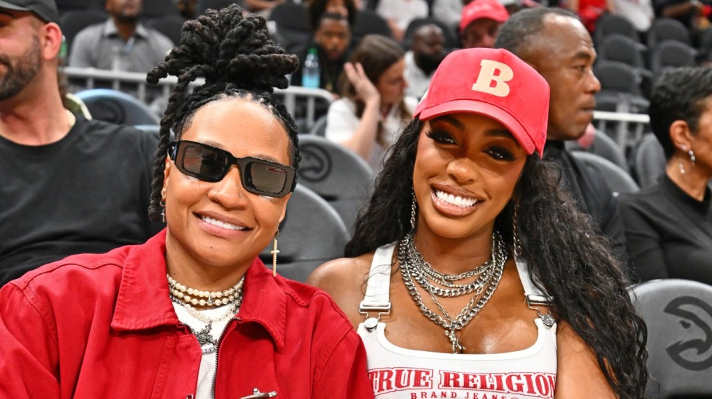 Patrice "Sway" McKinney and Porsha Williams attend the game between the Dallas Mavericks and the Atlanta Hawks at State Farm Arena