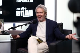 Andy Cohen with a book in his lap, holding his arms out in disbelief while recording for Radio Andy