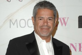 Lee Najjar in a black suit posing at a red carpet event