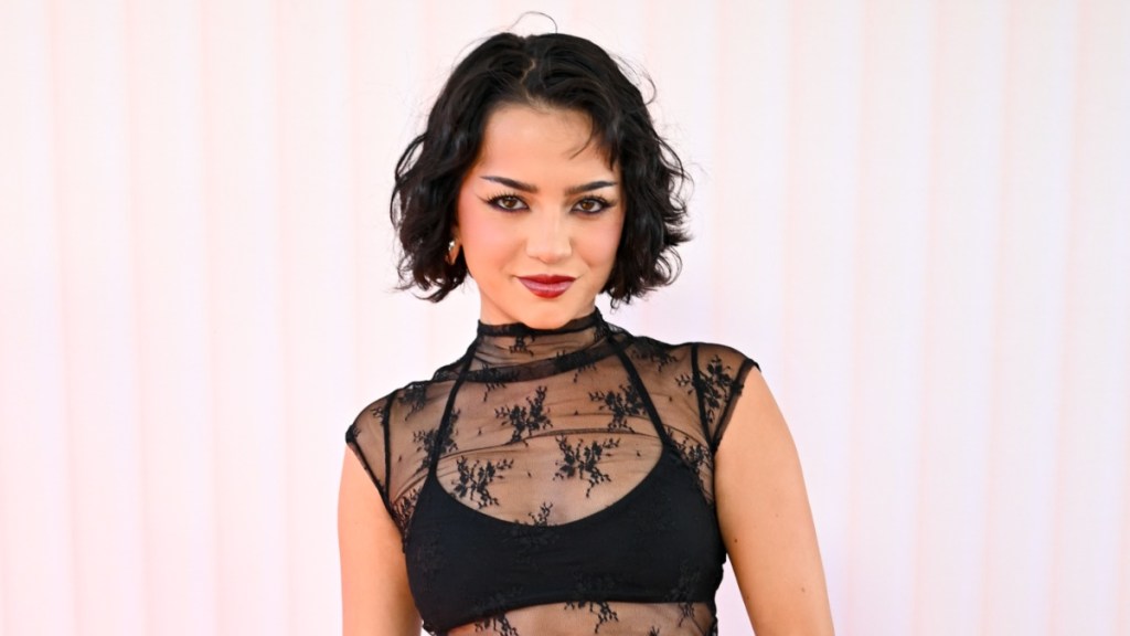 Isabela Merced mini skirt revolve festival sheer top