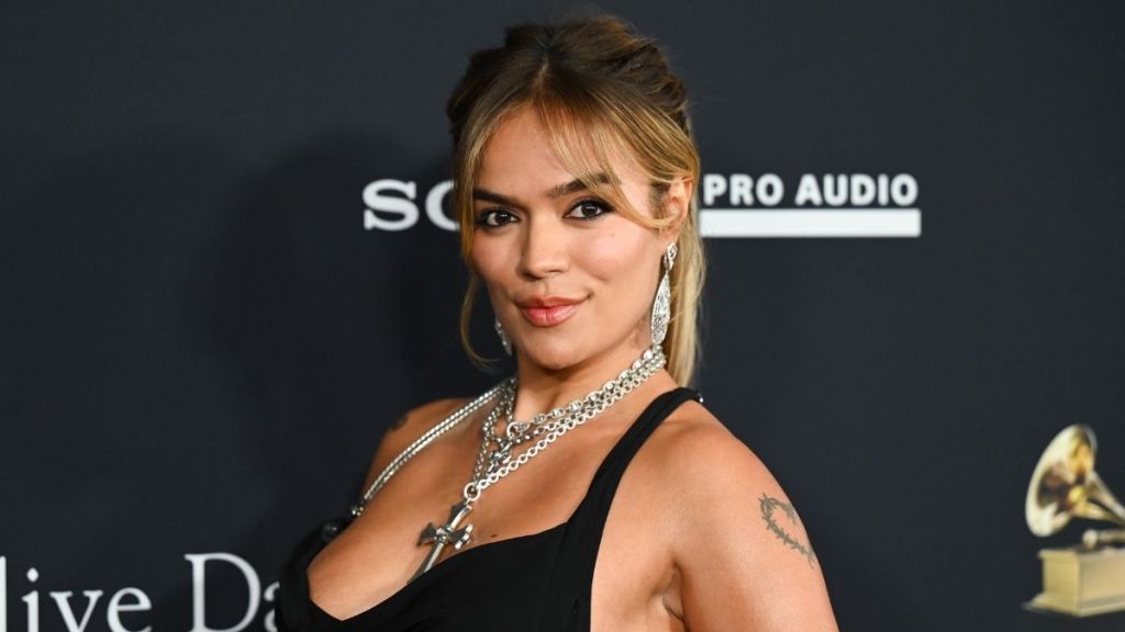 Karol G's Crop Top & Bikini Bottoms Look Reveals a Surprise for Playboy