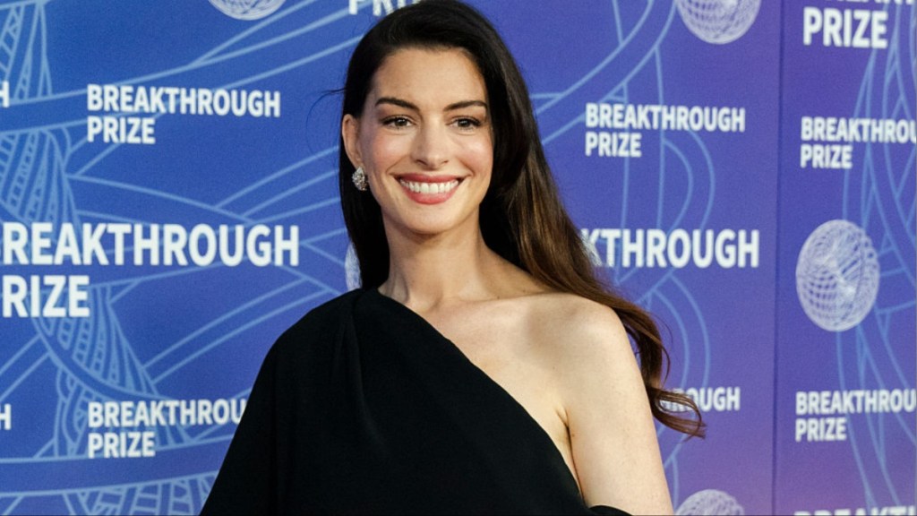 Anne Hathaway’s High Slit Ralph Lauren Dress Boldly Slips Off-The-Shoulder