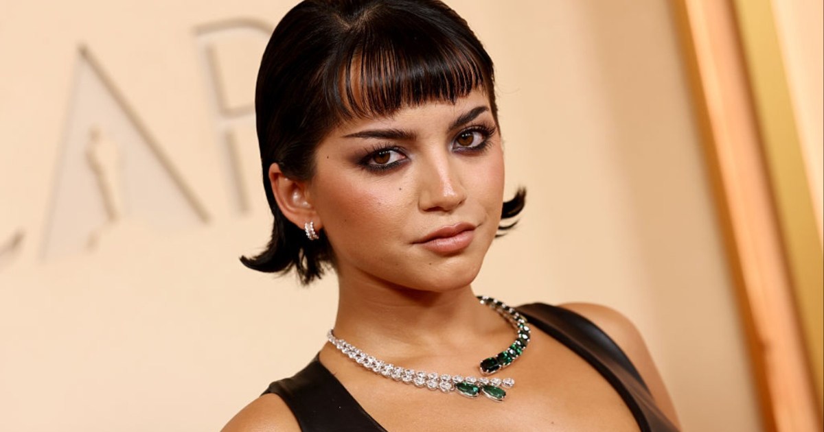 Isabela Merced’s Bold Neckline Mini Dress Will Make You Look Twice