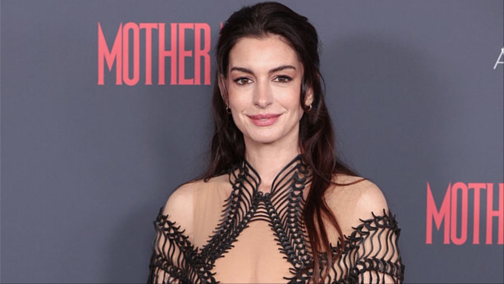 Anne Hathaway Elevates Chanel Micro Minidress With Fully Sheer Tights