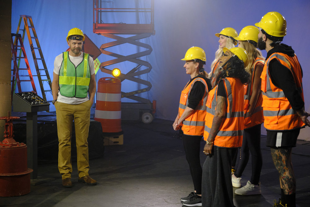 Joel McHale and the Houes of Villains cast dressed as construction workers