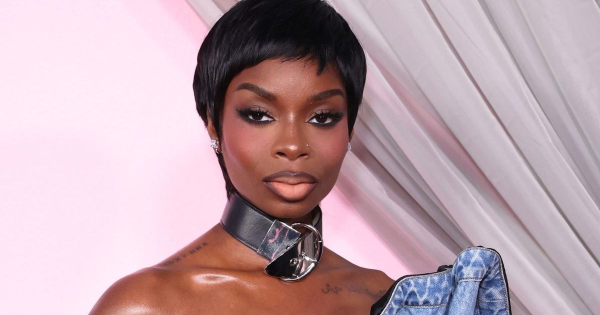 Olandria Carthen Becomes Iconic 1959 Barbie in Striped Swimsuit & Ponytail