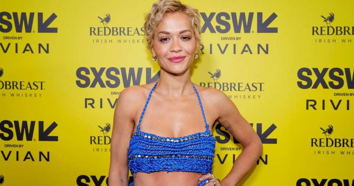 Rita Ora’s Fully Sheer Javier Saiach Lace Dress Features…