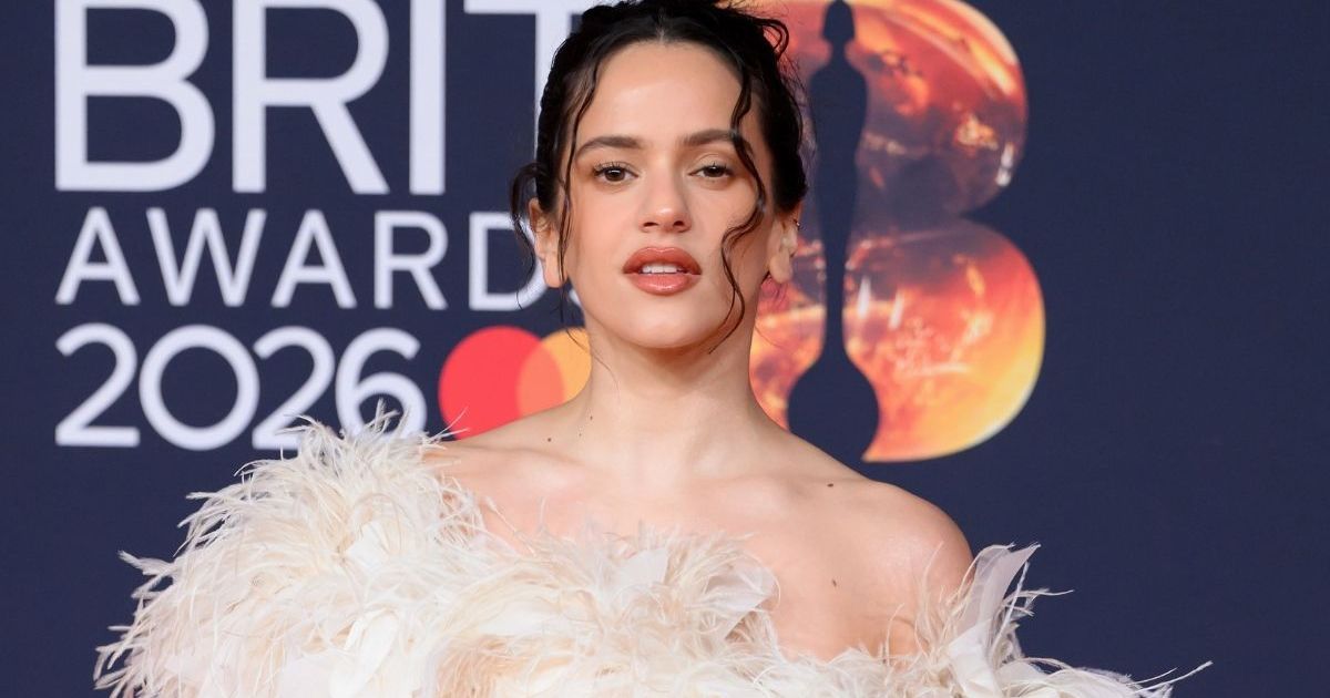 Rosalia’s Micro Crop Top & Skirt Look Gets Dangerously High Slit for CK