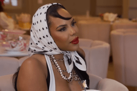 Kelli Ferrell in a black and white polka dot headscarf wrapped