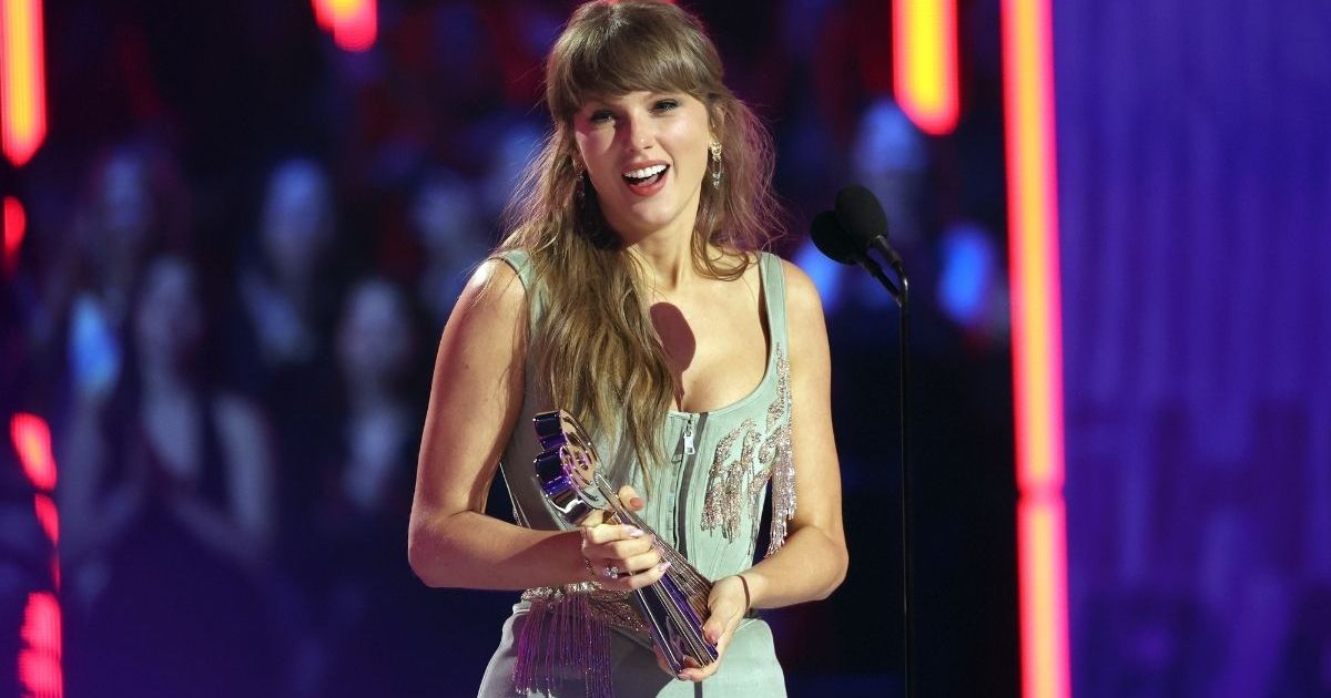 Taylor Swift's Cami Top Hangs by 2 Strings Over Bridal Meshki Skirt