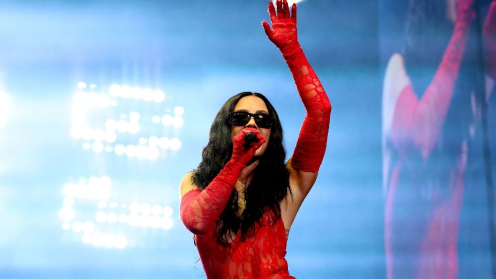 Demi Lovato Raises the Heat in Fully Sheer Plunging Bodysuit & Fishnets