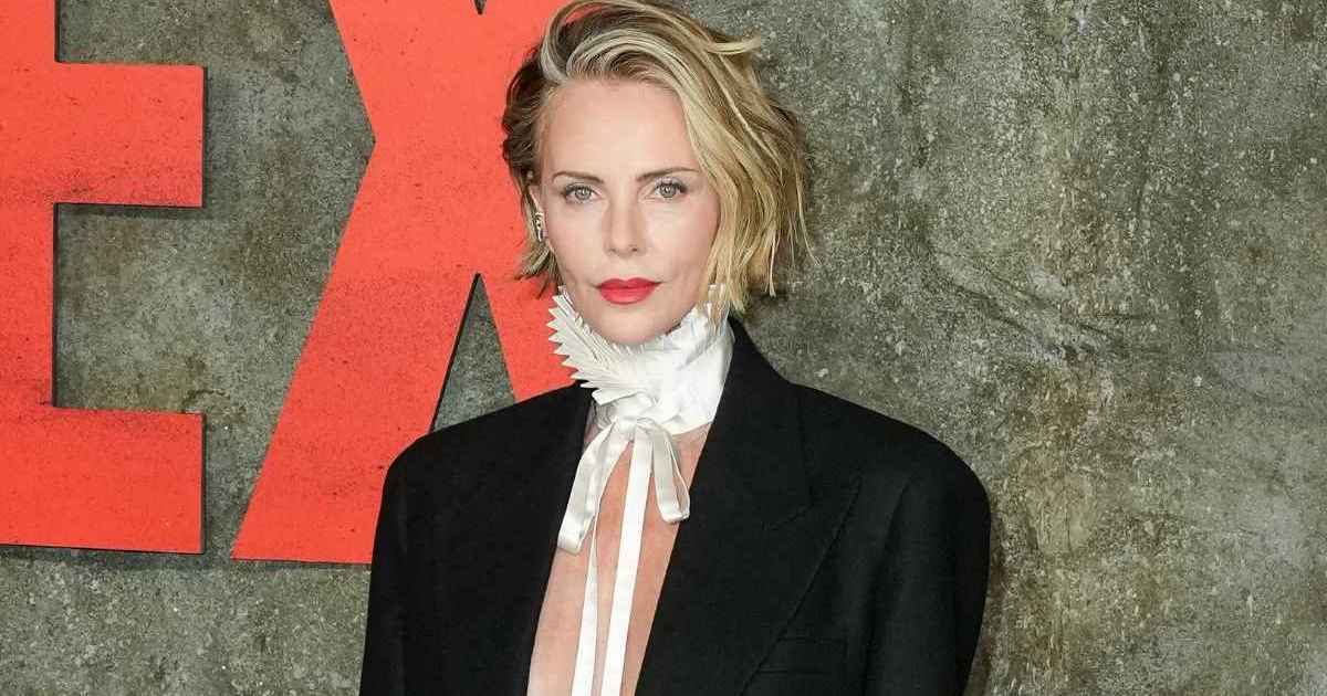 Charlize Theron Boldly Leaves Dior Suit Jacket Open With Neck Collar