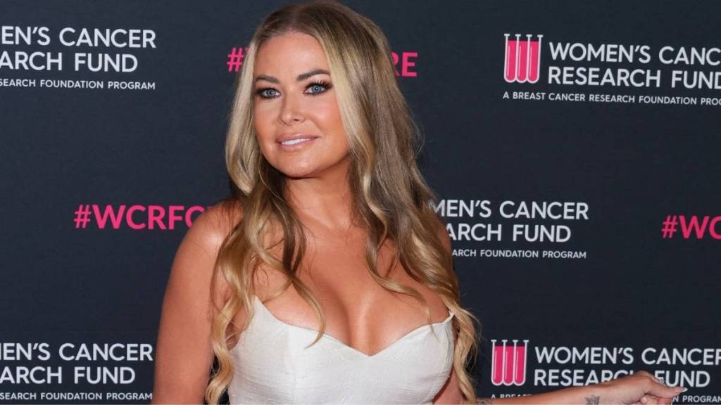 Carmen Electra Shows off Her Curves in Retro High-Cut Bodysuit