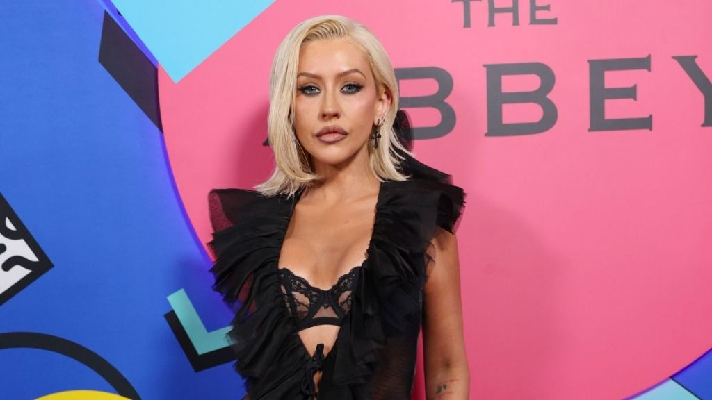 Christina Aguilera Nearly Pops Out of a Sheer Lace Bra Beneath a Wide-Open Top