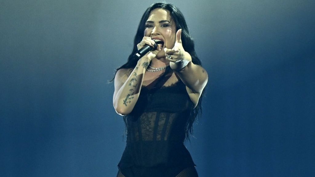 Demi Lovato’s See-Through Bodysuit Dips Down To Expose Bikini Top