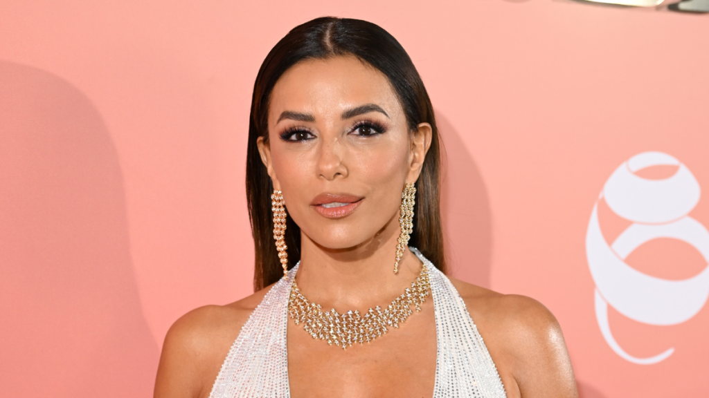 Eva Longoria’s Plunging Cong Tri Dress Comes With a Sky-High Slit