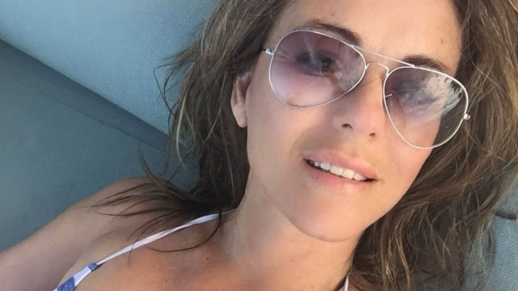 Elizabeth Hurley Lounges in a Tiny Bikini That Barely Covers Anything