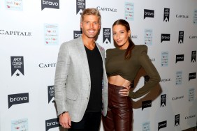 Kyle Cooke and Amanda Batula posing on a red carpet