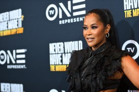 Lisa Wu attending a TV One red carpet wearing a black dress