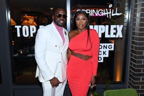 Eddie Osefo in a white suit posing with Wendy Osefo in a red dress