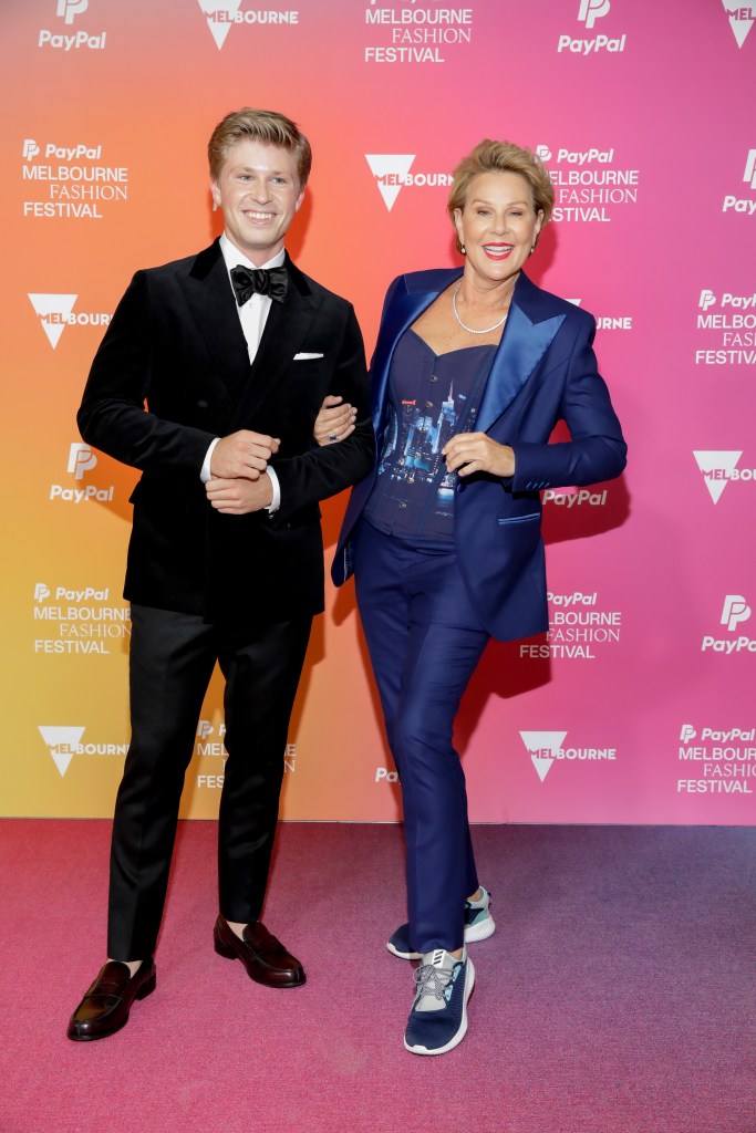 Julia Morris and Robert Irwin in suits at a red carpet event