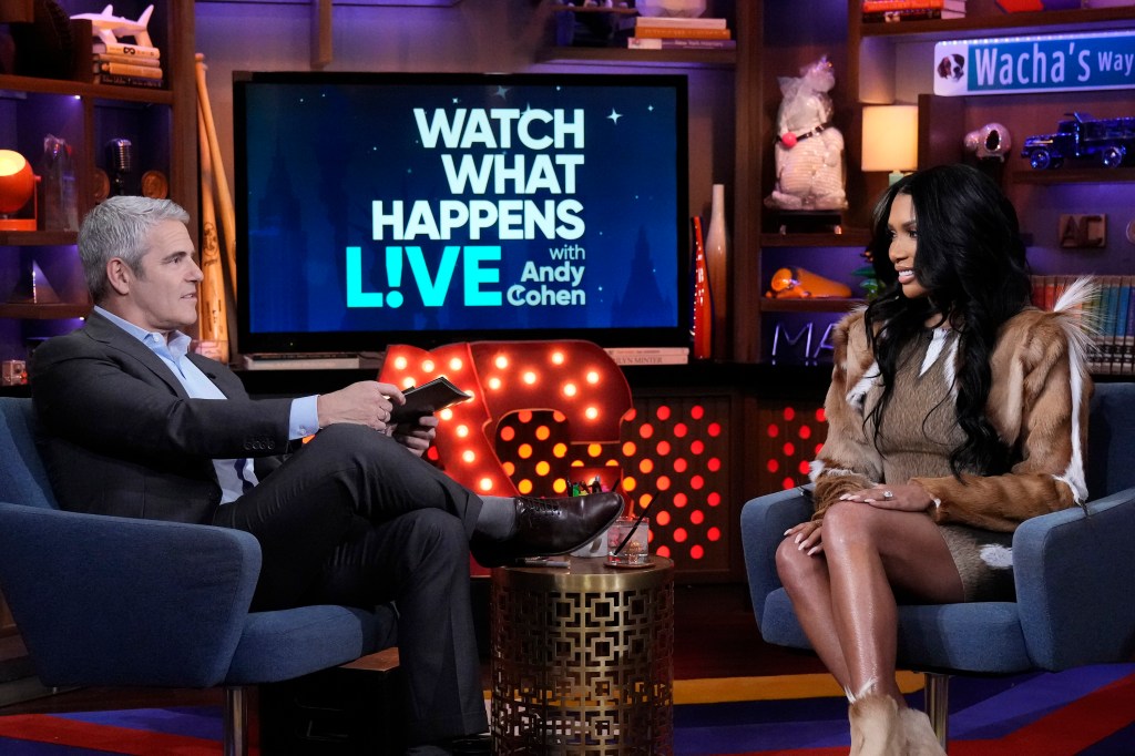Brit Eady and Andy Cohen sitting across from each other on Watch What Happens Live